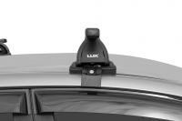 Багажник на крышу LUX, крепление за дверные проемы для Nissan Qashqai (J10) внедорожник 2007-2013 (БК1+прямоугольные дуги 1,3м+КА LUX Qashqai07n) от магазина ФаркопРос